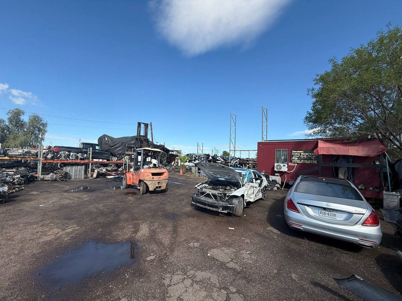 Rows of vehicles and parts at Jordan Auto Wrecking in Phoenix
